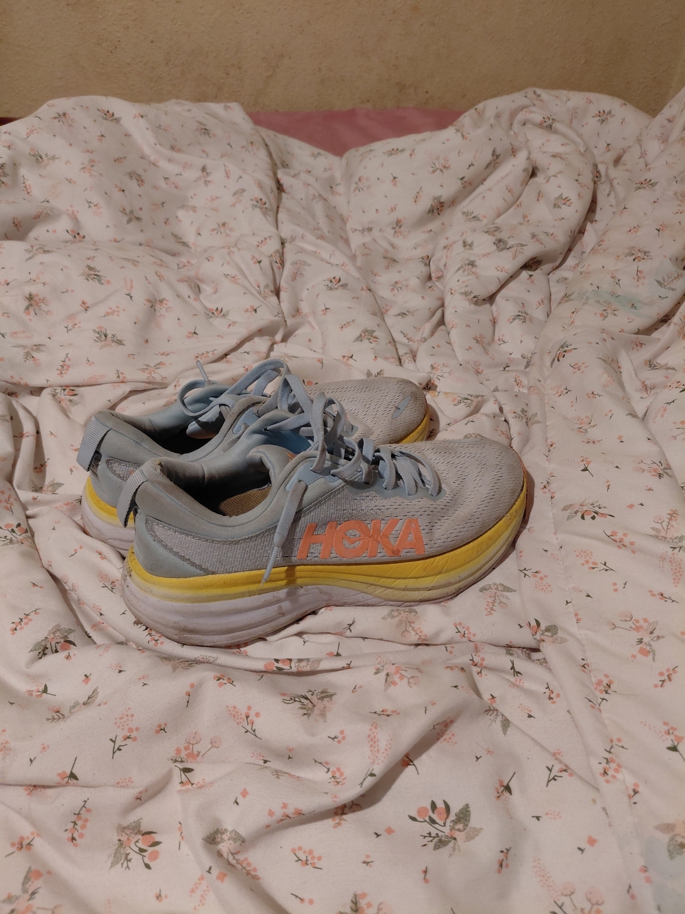 Hoka Women's Light Blue Running Shoes with Yellow and Orange Accents